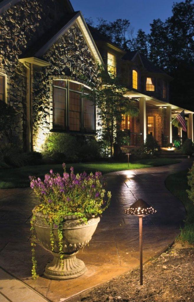 An image of anilluminated pathway outside a home