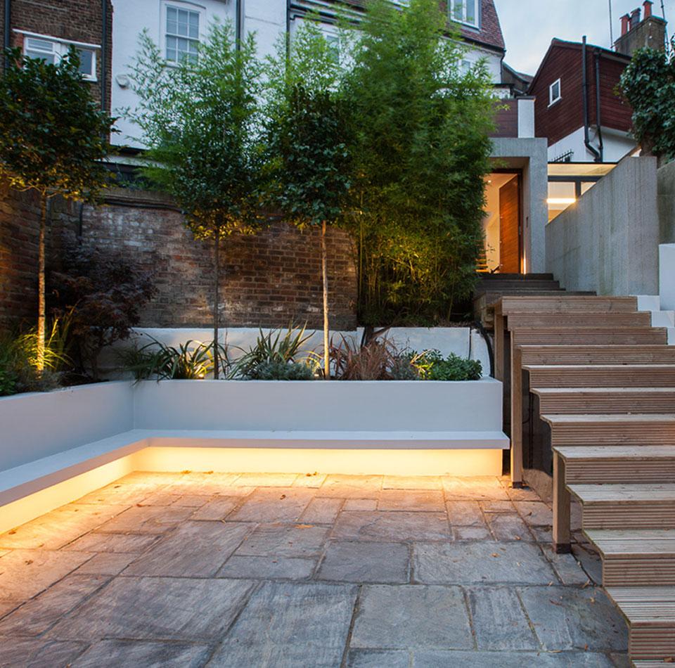An image of a home’s landscape lighting