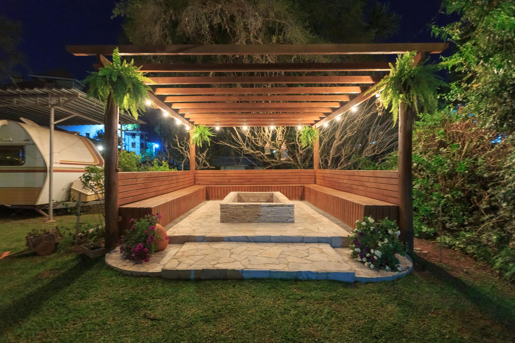 Backyard patio with lighting for a cozy ambiance.