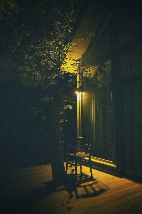 A house with only one dim outdoor bulb, making it vulnerable to break-ins.