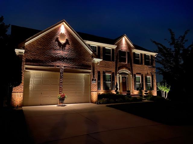 House exterior with well-designed residential walkway lighting